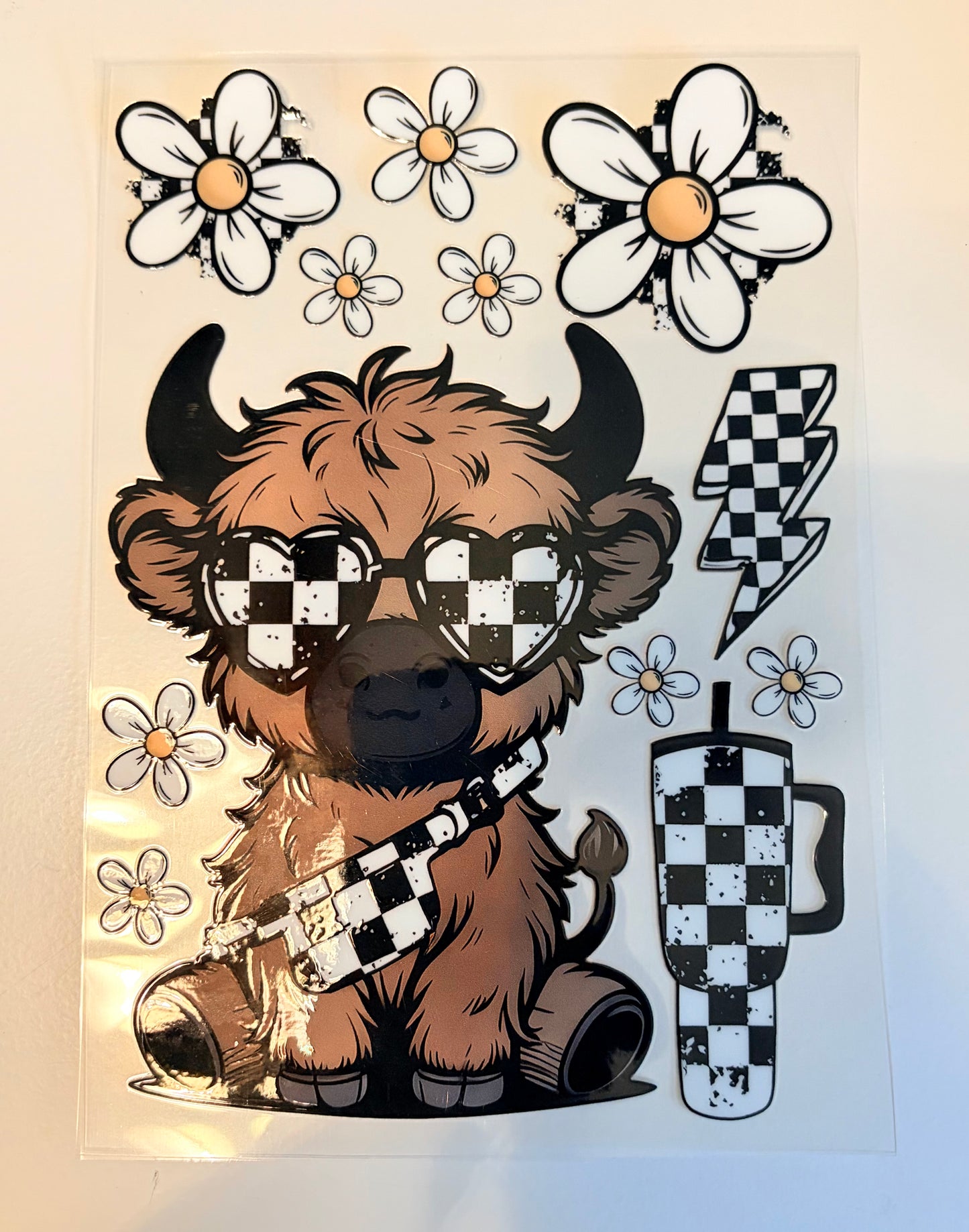 Highland cow with cup